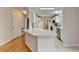 Modern kitchen with white cabinets, stone countertops and stainless steel appliances, plus convenient breakfast bar at 525 Hunnicutt Se Rd, Mableton, GA 30126