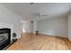Spacious living room featuring hardwood floors, fireplace, and neutral paint at 525 Hunnicutt Se Rd, Mableton, GA 30126