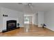 Bright living area with hardwood floors, a cozy fireplace, and access to the outdoor deck at 525 Hunnicutt Se Rd, Mableton, GA 30126