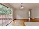 Bright open concept living room with door to deck with wooded view at 525 Hunnicutt Se Rd, Mableton, GA 30126