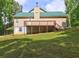 Back of house showcasing a wooden deck, providing space for outdoor seating and entertainment at 165 Country Mill Ln, Stockbridge, GA 30281