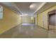 Large basement with yellow painted walls and concrete floors is ready to be upgraded at 165 Country Mill Ln, Stockbridge, GA 30281