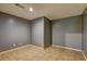 Small basement with tiled floors and gray walls could be finished into a private suite at 165 Country Mill Ln, Stockbridge, GA 30281