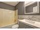 Cozy bathroom with modern vanity, white tub, and sleek gray walls at 165 Country Mill Ln, Stockbridge, GA 30281