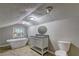 Bathroom showcasing a standalone tub, vanity with sink, and a toilet at 165 Country Mill Ln, Stockbridge, GA 30281
