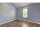 Bright bedroom with natural light and hardwood floors at 165 Country Mill Ln, Stockbridge, GA 30281