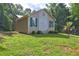 Charming single-Gathering home with a well maintained lawn, mature landscaping, and inviting curb appeal at 165 Country Mill Ln, Stockbridge, GA 30281