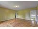 Bright living room with gleaming wood floors and multiple entryways at 165 Country Mill Ln, Stockbridge, GA 30281