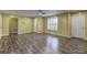 Inviting living room with ample space, featuring durable floors, a large window, and multiple entry points at 165 Country Mill Ln, Stockbridge, GA 30281