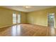 Bright living room with wood floors and glass patio doors at 165 Country Mill Ln, Stockbridge, GA 30281