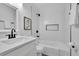 Bright bathroom featuring white subway tile, black fixtures, and marble countertops at 2222 Beecher Sw Cir, Atlanta, GA 30311