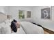 Comfortable bedroom featuring a plush bed with stylish pillows and decor art at 2222 Beecher Sw Cir, Atlanta, GA 30311