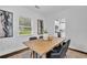 Cozy dining room featuring hardwood floors, a wooden table, and lots of natural light at 2222 Beecher Sw Cir, Atlanta, GA 30311