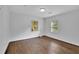 Cozy empty room featuring hardwood floors, freshly painted walls, and natural light from windows at 2222 Beecher Sw Cir, Atlanta, GA 30311