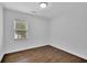 Cozy empty room featuring hardwood floors, freshly painted walls, and natural light from windows at 2222 Beecher Sw Cir, Atlanta, GA 30311