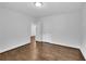 Spacious empty room featuring hardwood floors and freshly painted white walls at 2222 Beecher Sw Cir, Atlanta, GA 30311