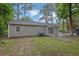 Exterior view of the home with a gravel pathway and tree-lined yard at 2222 Beecher Sw Cir, Atlanta, GA 30311
