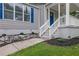 A closer view of the front porch with a walkway, showcasing the home's inviting entrance and detailed landscaping at 2222 Beecher Sw Cir, Atlanta, GA 30311