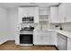 Updated kitchen showcasing white cabinets, quartz countertops, and stainless appliances at 2222 Beecher Sw Cir, Atlanta, GA 30311
