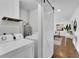 Functional laundry room featuring modern appliances, ample storage, and easy access from the main living area at 2222 Beecher Sw Cir, Atlanta, GA 30311