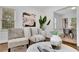 Close-up shot of living room decor showcasing modern furniture, stylish accents, and a glimpse of the dining area at 2222 Beecher Sw Cir, Atlanta, GA 30311
