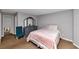Bedroom with carpet, dresser, chair, and a bed with pink blanket at 6744 Rockbridge Rd, Stone Mountain, GA 30087
