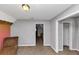 Bedroom featuring neutral walls, carpet flooring, and multiple doorways providing access to other spaces at 6744 Rockbridge Rd, Stone Mountain, GA 30087