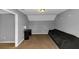 Bedroom featuring neutral walls, carpet flooring, a desk, and a sofa at 6744 Rockbridge Rd, Stone Mountain, GA 30087