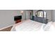 Bedroom with carpet, dresser, chair, and a bed with pink blanket at 6744 Rockbridge Rd, Stone Mountain, GA 30087