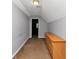 Attic bedroom featuring neutral walls, carpet flooring, and a dresser for storage at 6744 Rockbridge Rd, Stone Mountain, GA 30087