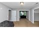 Bedroom featuring neutral walls, carpet flooring, a dresser, and a window at 6744 Rockbridge Rd, Stone Mountain, GA 30087