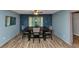 Stylish dining room with wood-look flooring, perfect for Gathering meals and entertaining guests at 6744 Rockbridge Rd, Stone Mountain, GA 30087