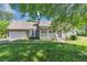 Charming single-story home with a covered porch, attached garage, and well-maintained lawn at 6744 Rockbridge Rd, Stone Mountain, GA 30087