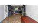 Kitchen with navy cabinets, stainless appliances, white brick wall and tile floor at 6744 Rockbridge Rd, Stone Mountain, GA 30087