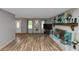 Cozy living room features wood floors and a decorative fireplace, creating a comfortable space at 6744 Rockbridge Rd, Stone Mountain, GA 30087