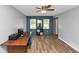 Bright home office area with gray and blue color scheme, wood flooring at 6744 Rockbridge Rd, Stone Mountain, GA 30087