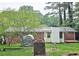 This backyard has a lush green lawn and mature trees at 2543 Asbury Court Ct, Decatur, GA 30033