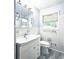 This bathroom has a white sink and toilet with light blue walls at 2543 Asbury Court Ct, Decatur, GA 30033