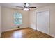 This sunny bedroom has a window, closet and hardwood floors at 2543 Asbury Court Ct, Decatur, GA 30033