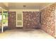 This carport has a red brick facade and concrete floors at 2543 Asbury Court Ct, Decatur, GA 30033