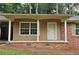 Close-up of the home's brick-and-siding front porch with an ADT security system visible at 2543 Asbury Court Ct, Decatur, GA 30033