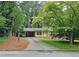Charming brick home with a well-maintained lawn and a covered carport on a tree-lined street at 2543 Asbury Court Ct, Decatur, GA 30033