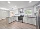 Bright kitchen features new stainless steel appliances, white cabinets, granite countertops, and subway tile backsplash at 2543 Asbury Court Ct, Decatur, GA 30033