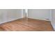 Spacious living room with hardwood floors and natural light. Door to another room visible at 2543 Asbury Court Ct, Decatur, GA 30033