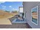 Cozy backyard patio with outdoor seating, perfect for relaxing in this modern, gray-sided house at 2766 Aralynn Way, College Park, GA 30337