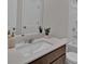 Clean bathroom features a modern vanity with ample countertop space, mirror, and a tub/shower combo at 2766 Aralynn Way, College Park, GA 30337