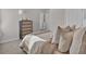 Cozy bedroom featuring soft bedding, natural light, and a complementing stylish chest of drawers at 2766 Aralynn Way, College Park, GA 30337