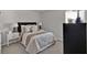 Relaxing bedroom with plush bed, neutral color palette, and coordinating nightstands and lamps at 2766 Aralynn Way, College Park, GA 30337