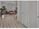 Spacious foyer with wood-look floors, neutral walls, and a view of the living area and staircase at 2766 Aralynn Way, College Park, GA 30337