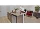 Open-concept kitchen featuring a large island with granite countertops and views of the living area at 2766 Aralynn Way, College Park, GA 30337